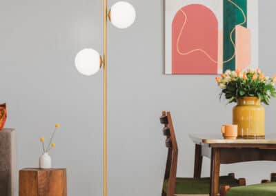 Vintage Living And Dining Room Interior With Retro Table With Chairs And Comfortable Sofa With Pillows